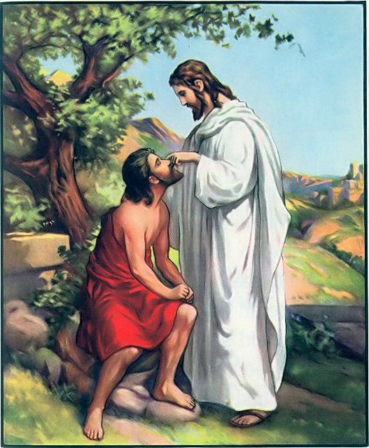 Jesus puts clay on the blind man's eyes